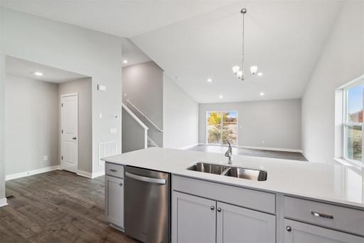 Stay connected with friends and family while you prepare food. Photo is of similar home. Colors and options may vary. Ask Sales Agent for details.
