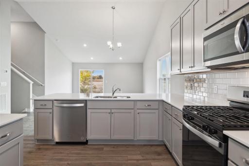 Plenty of sitting space at the oversized counter. Photo is of similar home. Colors and options may vary. Ask Sales Agent for details.