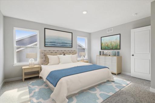 The primary bedroom on the upper level with an ensuite bathroom and large closet! Photo is of similar staged home. Colors and options may vary. Ask Sales Agent for details.