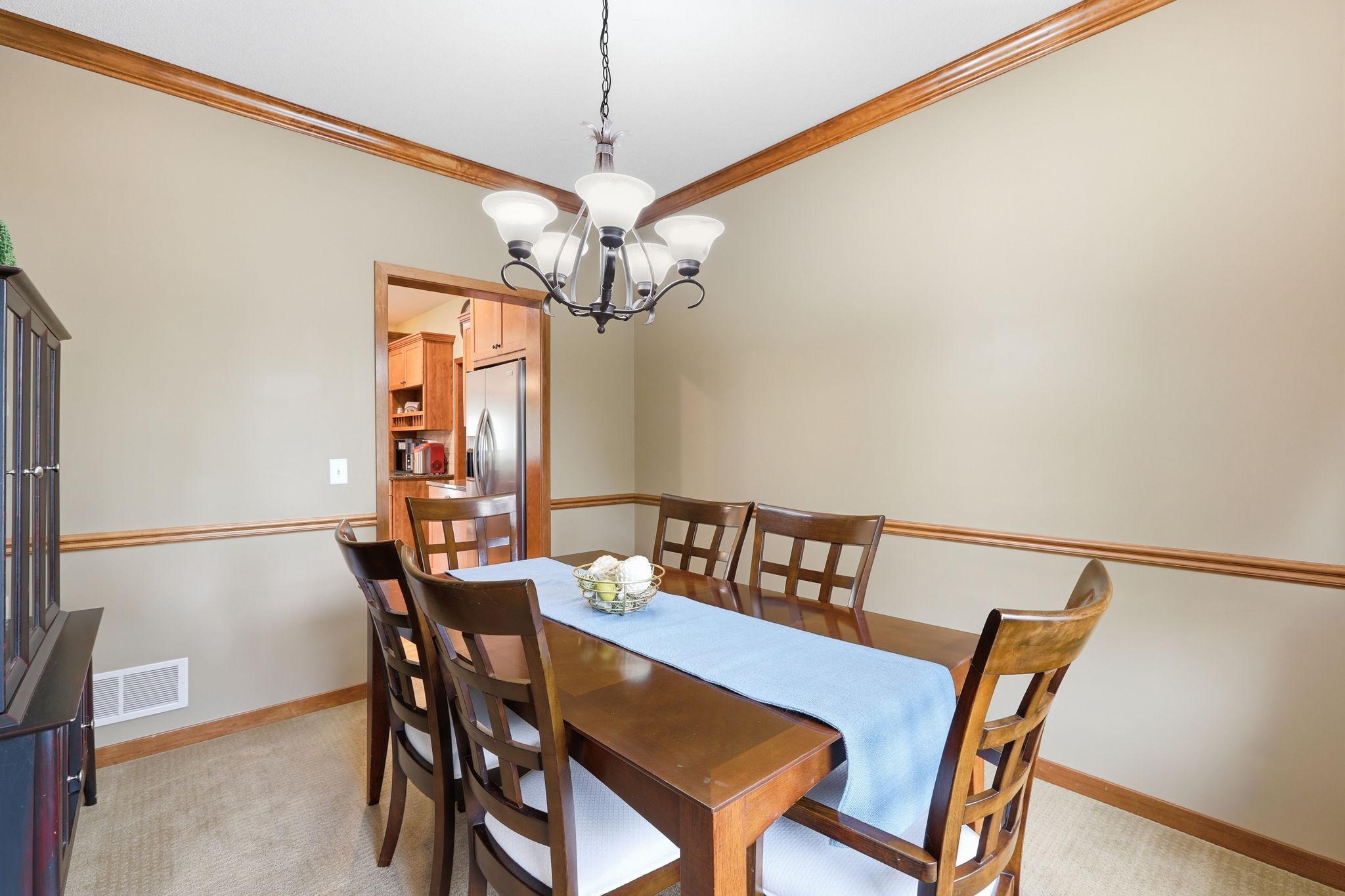 The formal dining room opens into the kitchen for easy access.