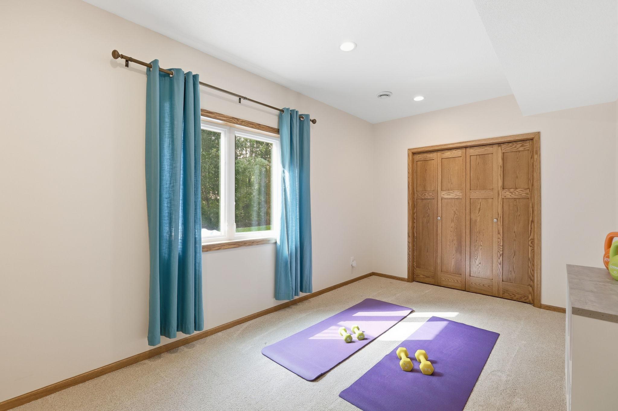 Lower level bedroom or workout room? You decide.