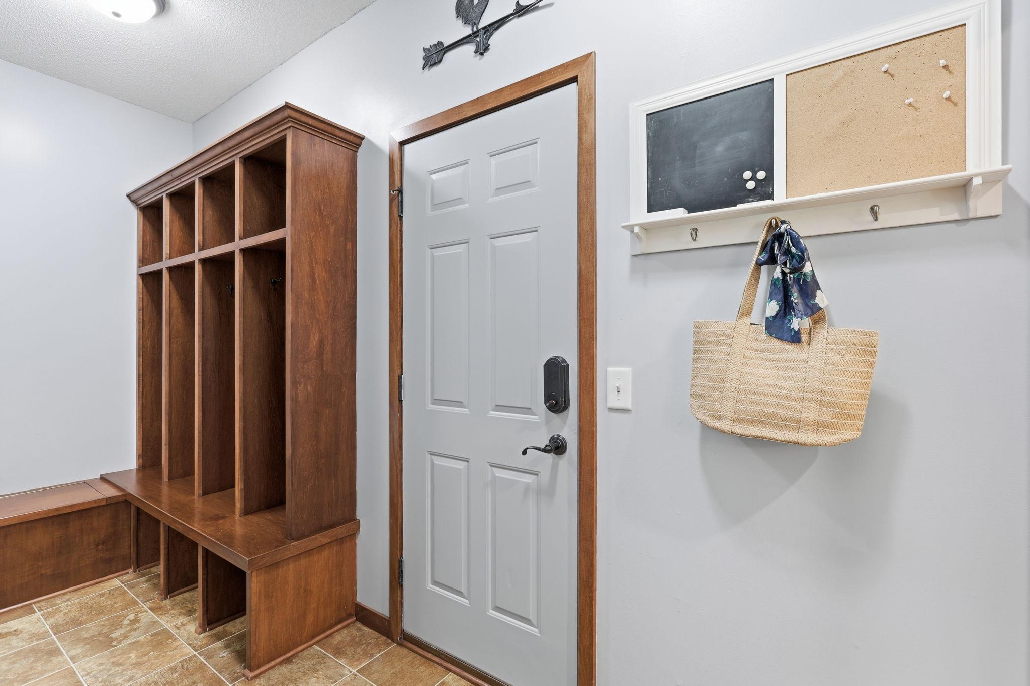 Built-in mudroom lockers make the drop zone very functional and the area even has a storage bench!