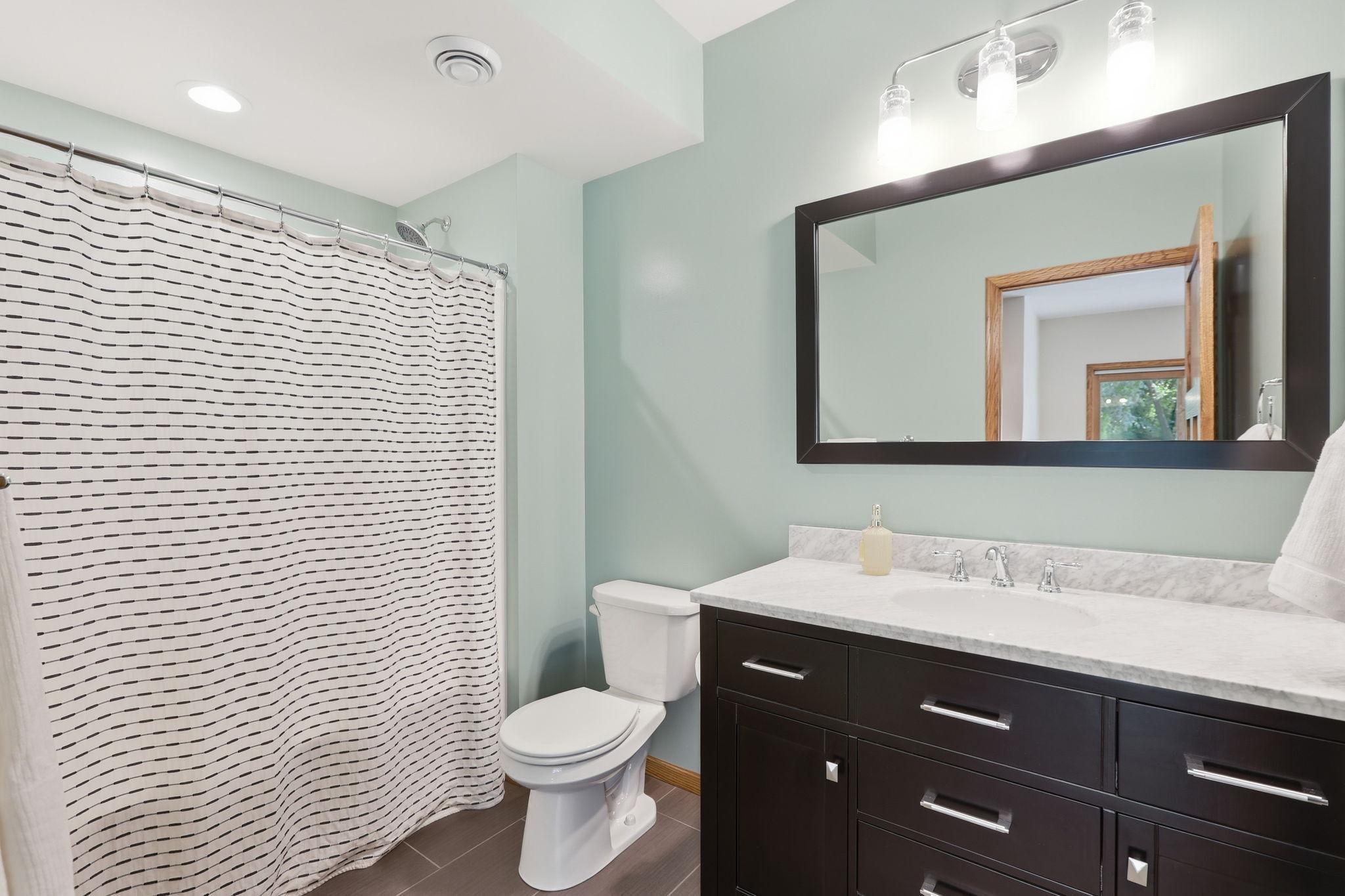 The full lower level bathroom is perfect for visitors to have their own bathroom.
