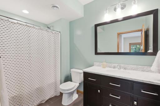 The full lower level bathroom is perfect for visitors to have their own bathroom.