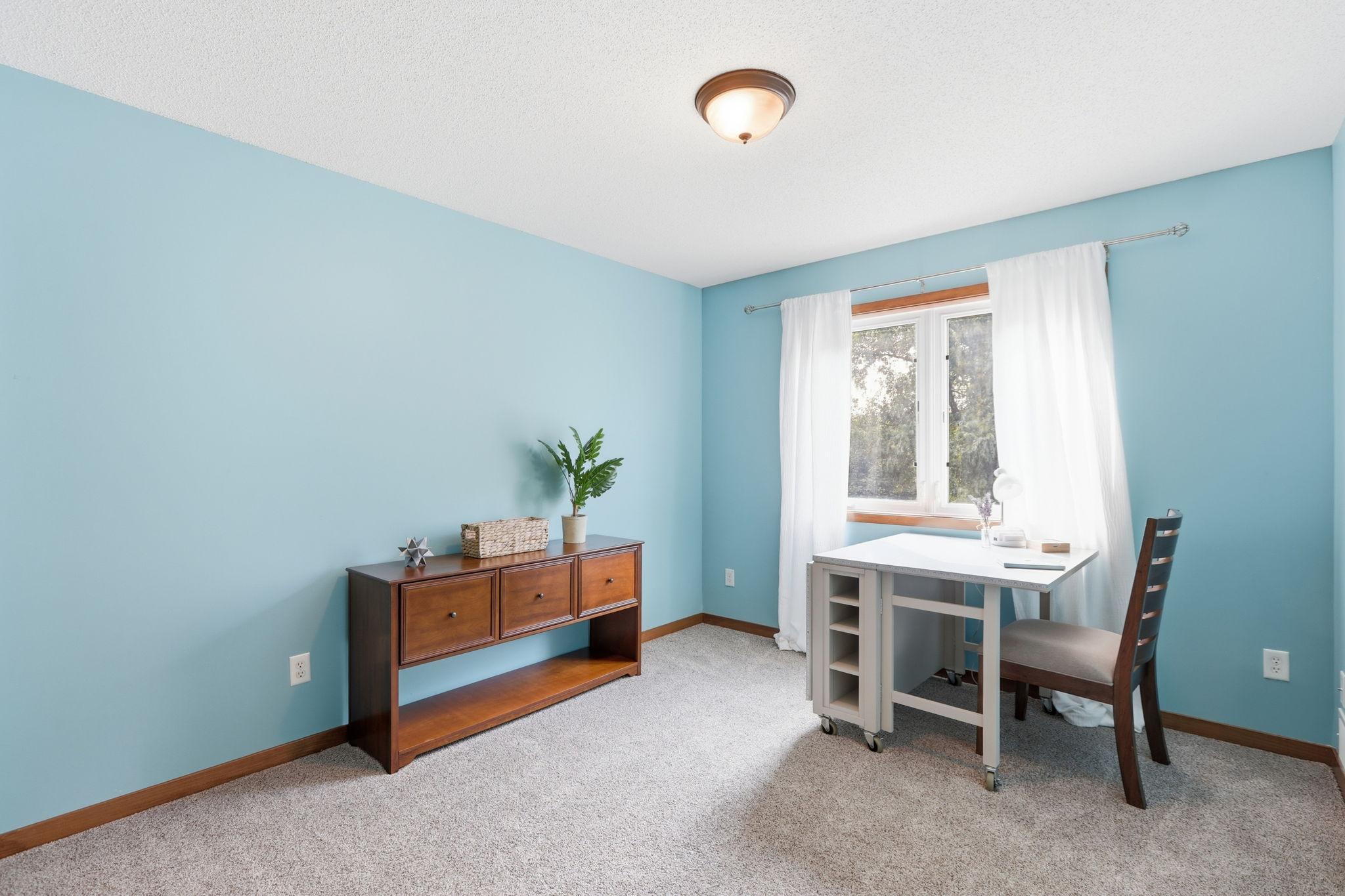 The fourth upper level bedroom overlooks the beautifully landscaped backyard and faces Westerly.