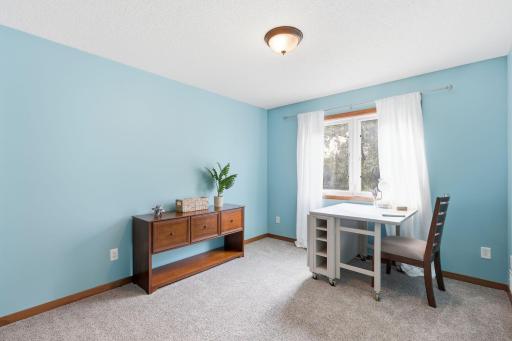 The fourth upper level bedroom overlooks the beautifully landscaped backyard and faces Westerly.