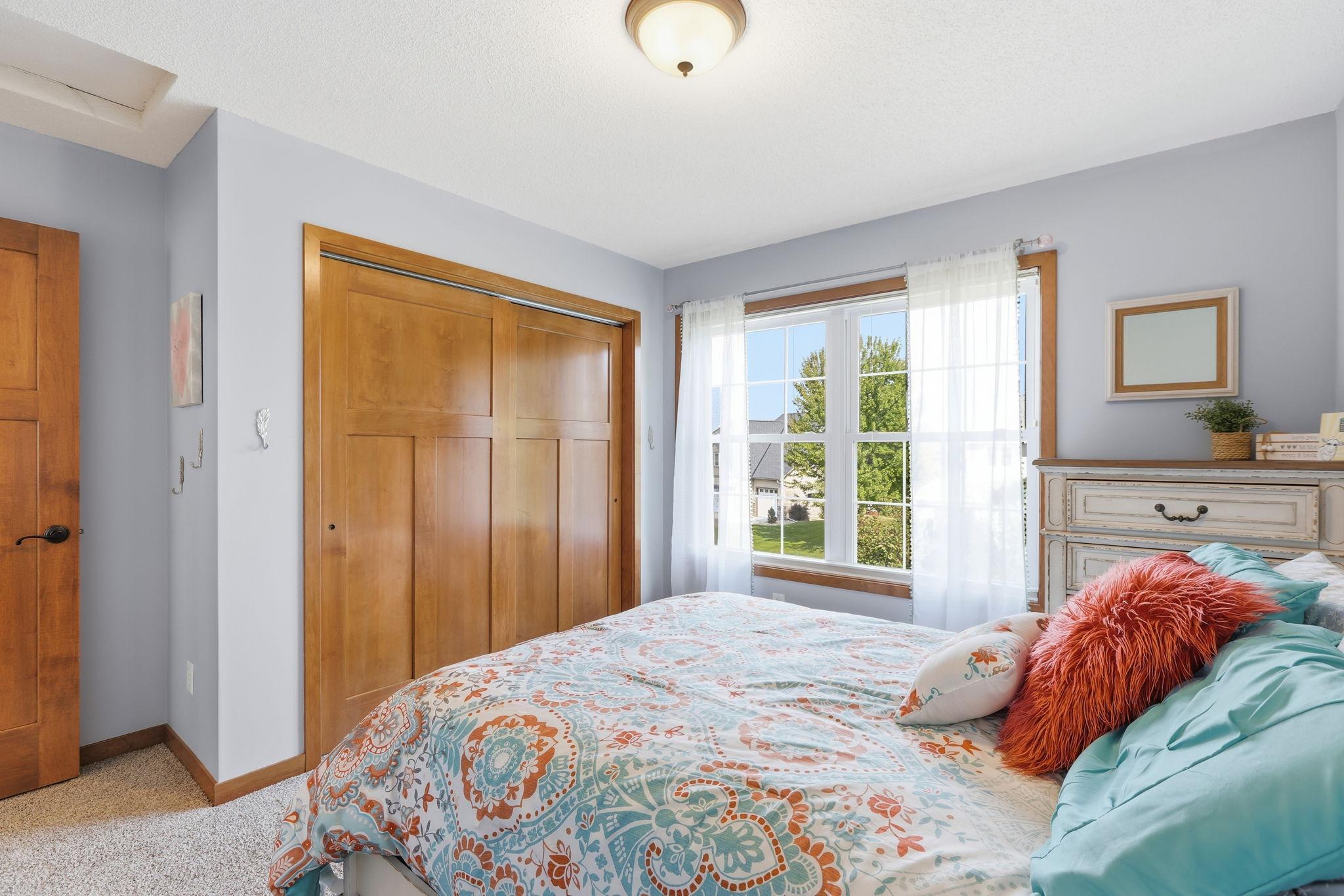 This Eastern-facing upper level 2nd bedroom shines with morning light.