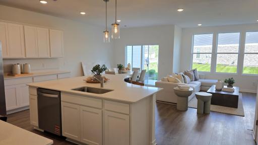 Kitchen opens to dining area and gathering room (Actual home - furniture not included)