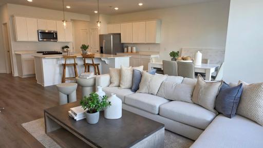 Bright main living space flows into the kitchen (Actual home - furniture not included)