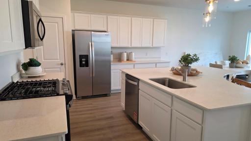 Kitchen with abundant cabinet and counter space (Actual home - furniture not included)