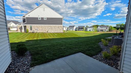 Private patio overlooking generous green space (Actual home - furniture not included)