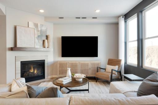 Cozy up on those cold Minnesota nights to your fireplace! (Option varies home to home). Photo of model home.