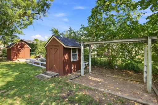 One of 2 storage sheds with a sandbox