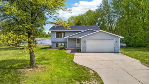 Enjoy peaceful waterfront living with mature trees, expansive green space, and access to the Chisago Lakes Water Trail.