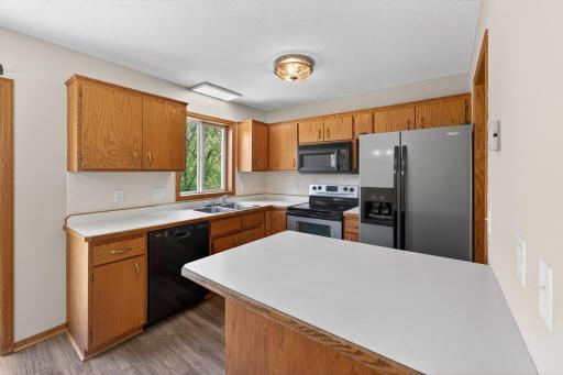 Enjoy scenic backyard and water views from the kitchen while preparing meals or entertaining family and guests.