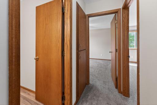 Upper-level hallway provides convenient access to two bedrooms and the full bathroom with functional split-entry layout design.