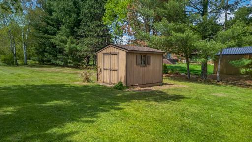 Additional storage shed/boathouse provides convenient space for lake toys, fishing gear, kayaks, paddleboards, and seasonal outdoor equipment.