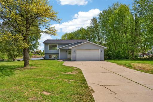 Beautifully maintained split-entry home nestled on a spacious lakeside lot with scenic North Center Lake views.