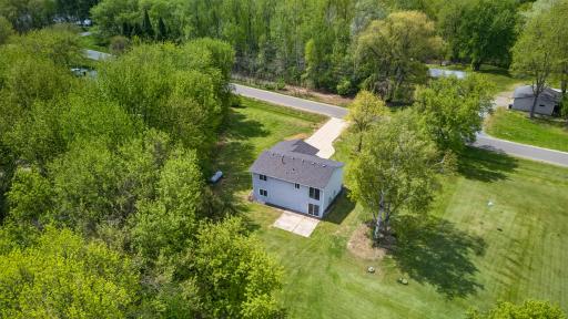 Tucked among mature trees and natural surroundings, creating a peaceful four-season Minnesota retreat.