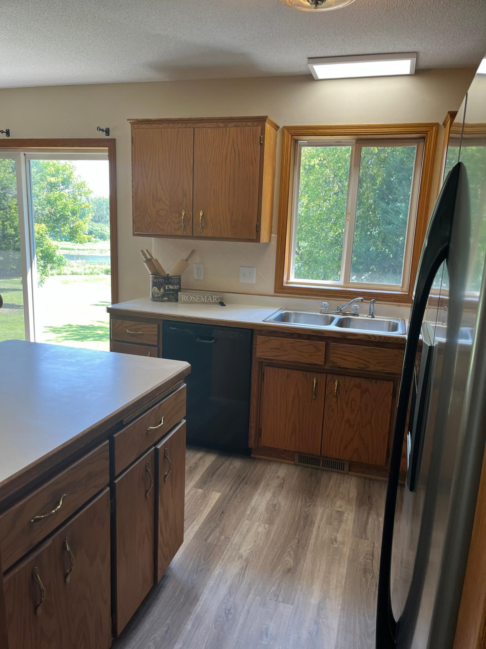 Scenic backyard and water views from the kitchen while preparing meals or entertaining family and guests.