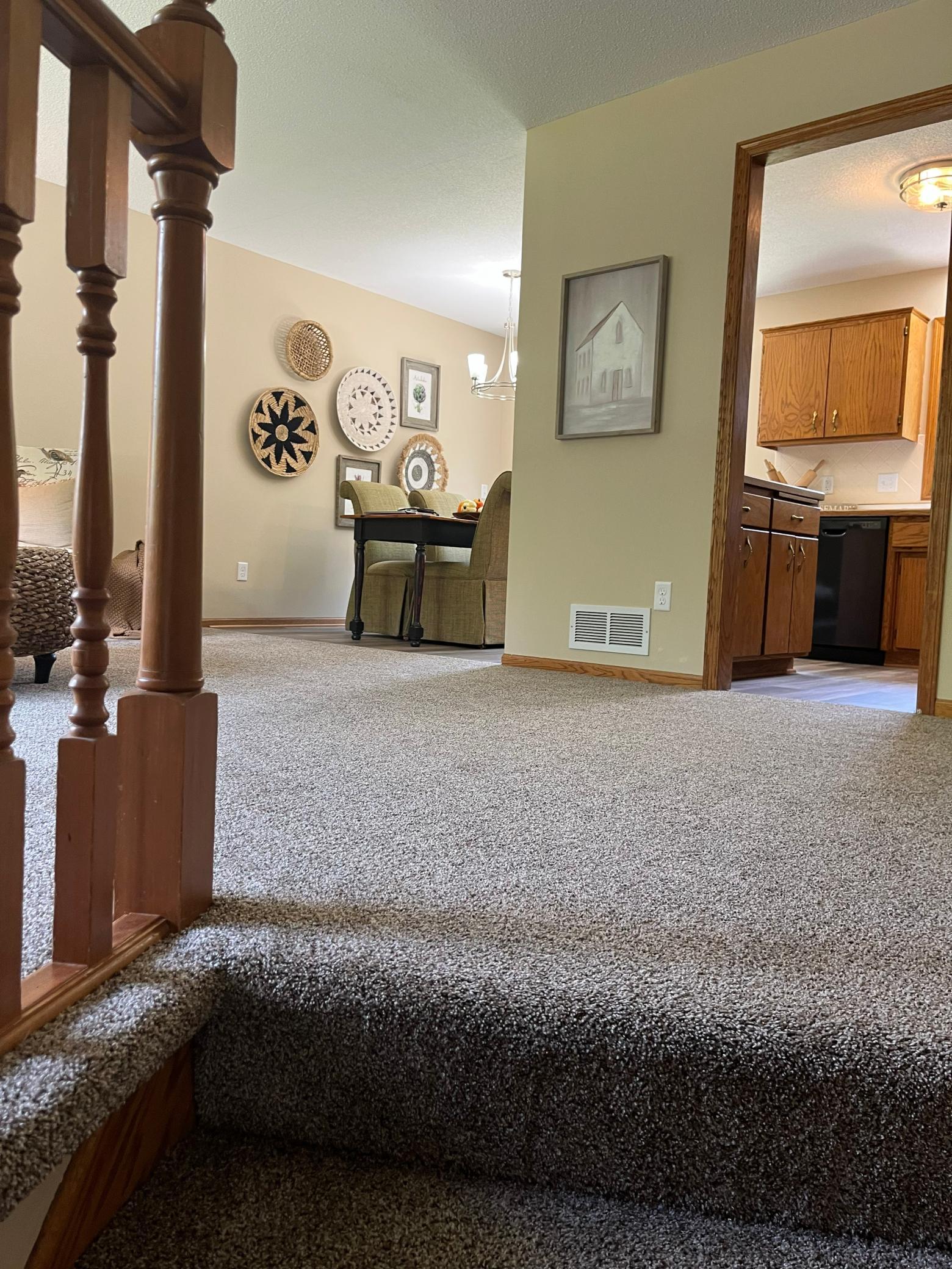Living room flows seamlessly into the dining area with sliding glass door access with beautiful backyard water views.