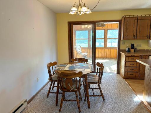 Another angle of the dining room with the sunroom beyond.