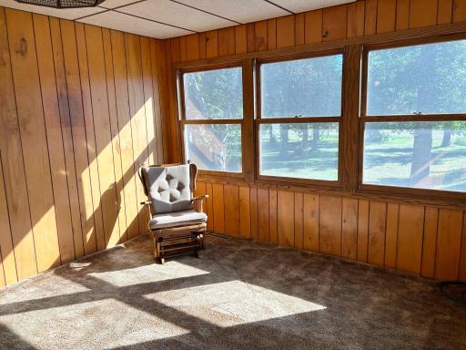 A shot of the sunroom / 4-season porch overlooking backyard.