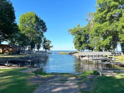 Harbor with your own dock/slip is just a hop skip and a jump right across the road from your home and garage on a beautifully treed lot setting...easy access harbor to MilleLacs without paying higher lakeshore taxes!
