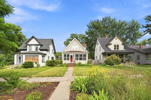 Welcoming front walk with beautiful gardens!