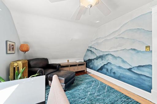 Inviting second bedroom with hardwood floors