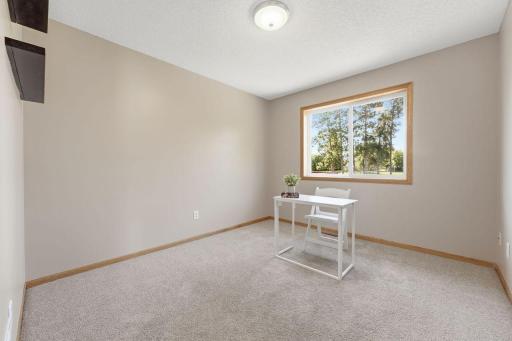 The second bedroom offers a pleasant view overlooking the backyard