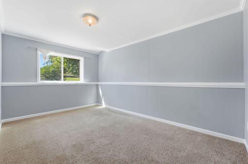 Large 5th bedroom also has backyard and golf course views.
