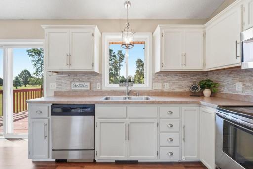 A large window over the sink provides a beautiful view of the backyard and golf course.