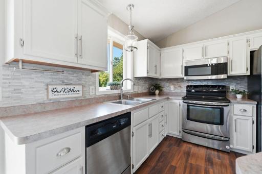 This generously sized kitchen offers an abundance of space, perfect for everyday living and entertaining.