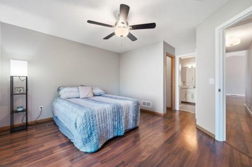 Another view of this room shows the large walk-in closet, and convenient walk-through access to the bathroom.