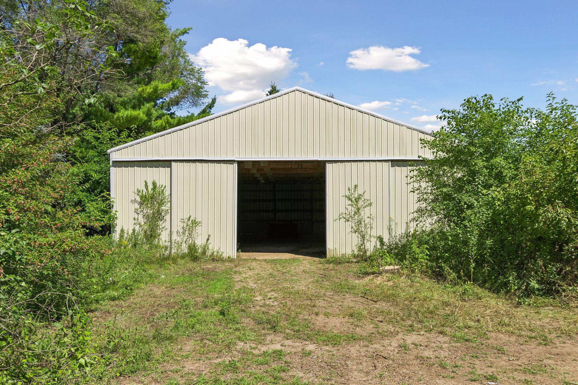 As if a 6-car attached garage wasn’t enough! An additional pole shed offers even more space for storage, equipment, toys and hobbies.