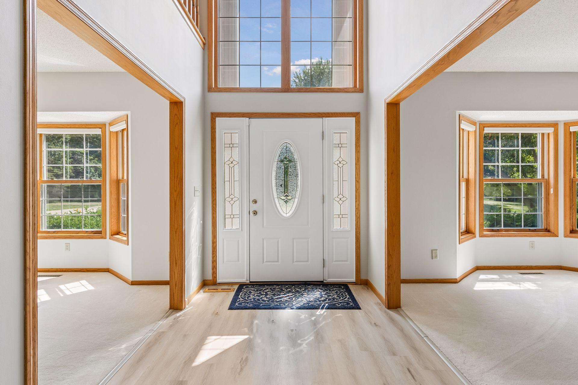 Welcome inside! The dramatic entry features vaulted ceilings, abundant natural light and an open, airy feel from the moment you walk through the door