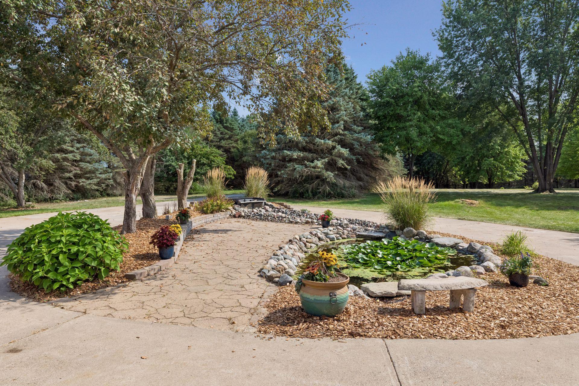 Imagine looking out over your own peaceful front lawn, complete with a charming waterfall feature, abundant green space and plenty of room to roam.