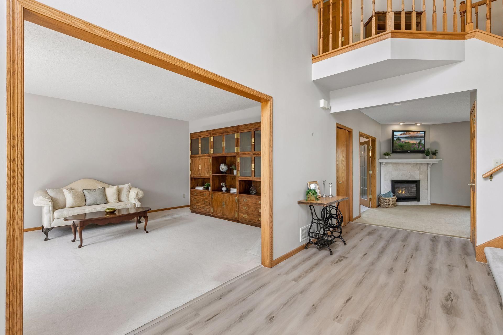 Just off the front entry, this inviting sitting room offers a wonderful additional space to gather, relax or make your own.