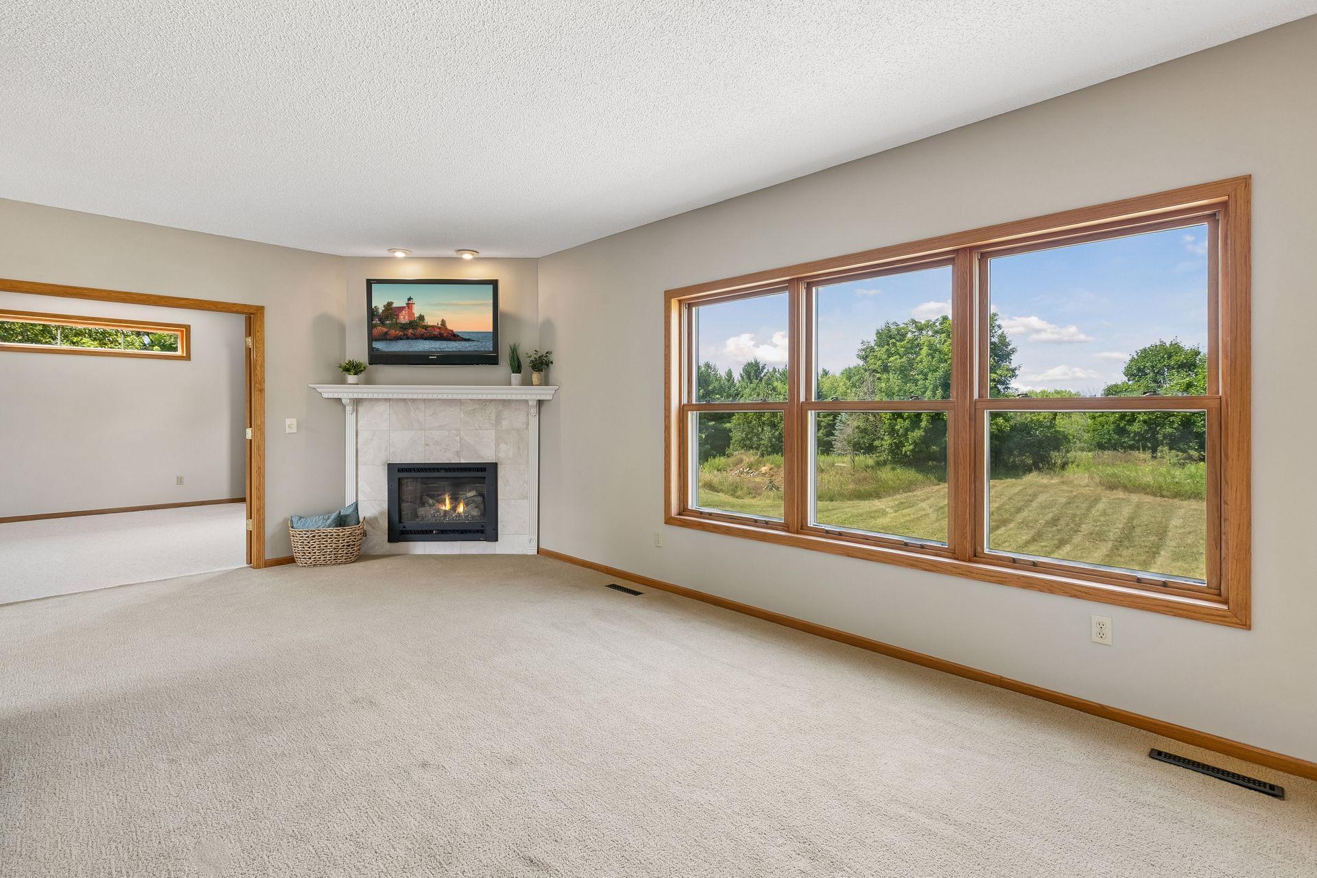 A gas fireplace anchors the family room, creating a cozy gathering spot to enjoy throughout the seasons.