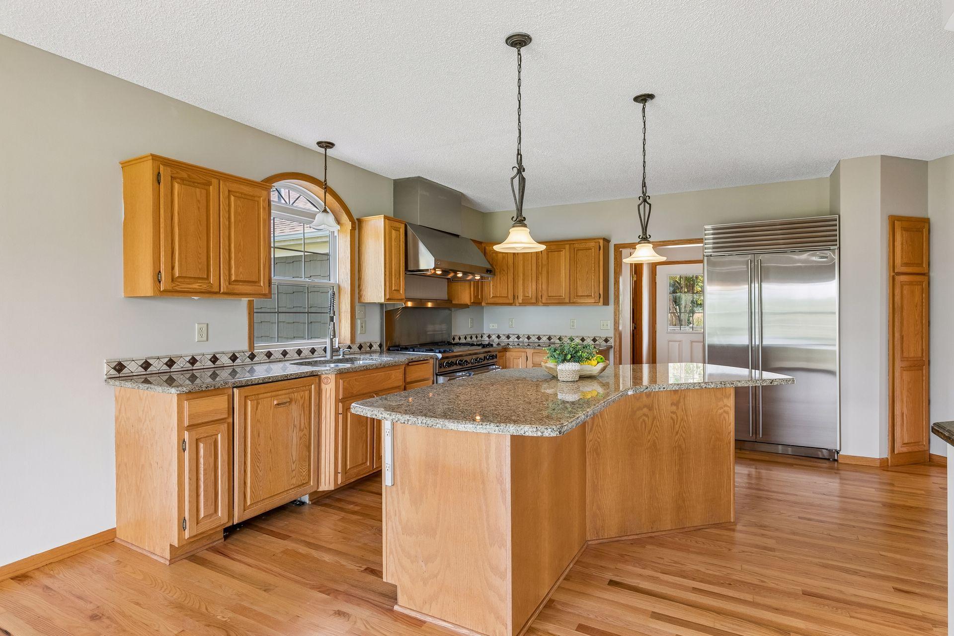 It’s all in the details—the gorgeous arched window above the kitchen sink brings character, natural light and a lovely view while you cook.