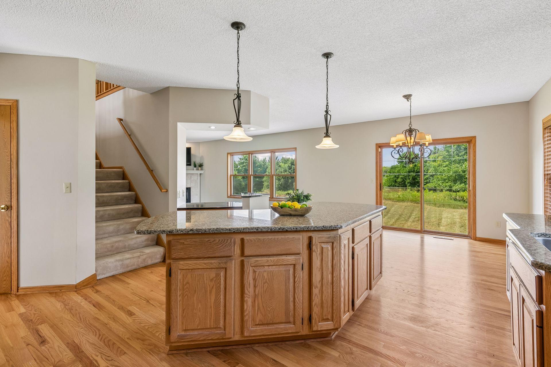 A view across the generous kitchen island showcases just how much space this kitchen offers for prepping, serving, entertaining and gathering.