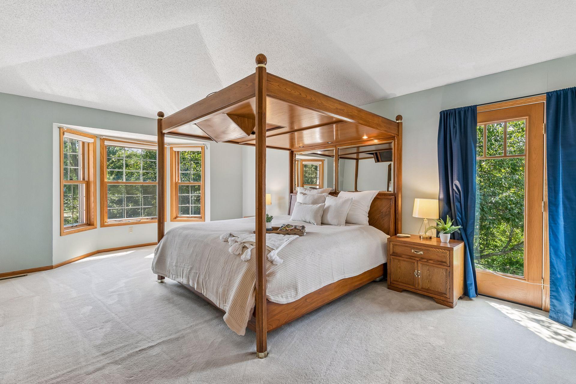 Welcome to the spacious primary suite! Vaulted ceilings add to the open, airy feel of this impressive upper-level retreat.