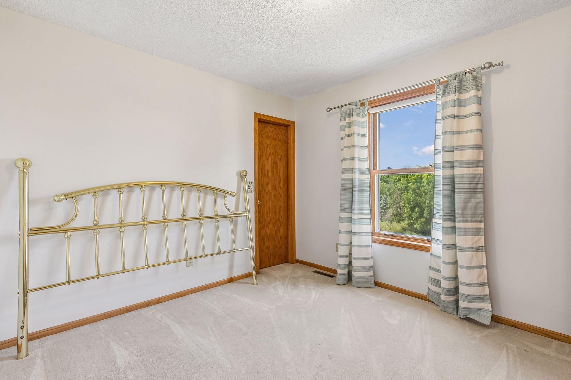 Upper-level bedroom two offers great space, natural light and convenient access to a Jack-and-Jill bathroom.