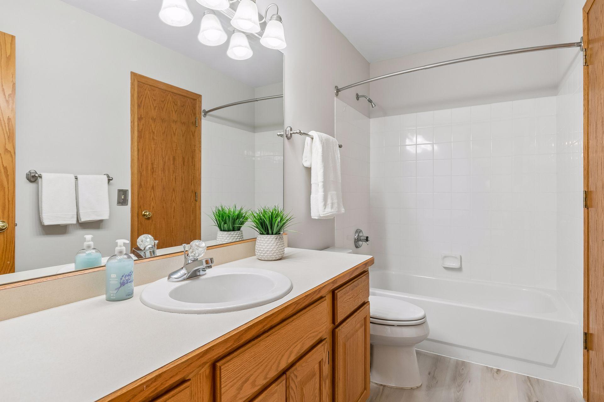 The third full bathroom on the upper level conveniently connects to bedroom four—an excellent setup for guests or family.