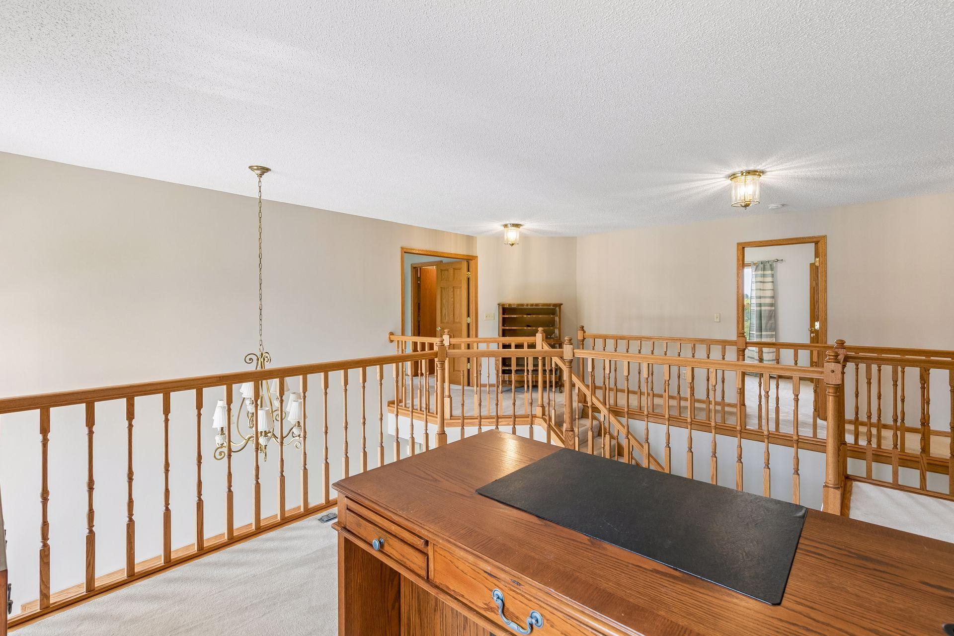 Looking across the upper level from the loft, you can really appreciate the openness, soaring entry and thoughtful layout of this home.