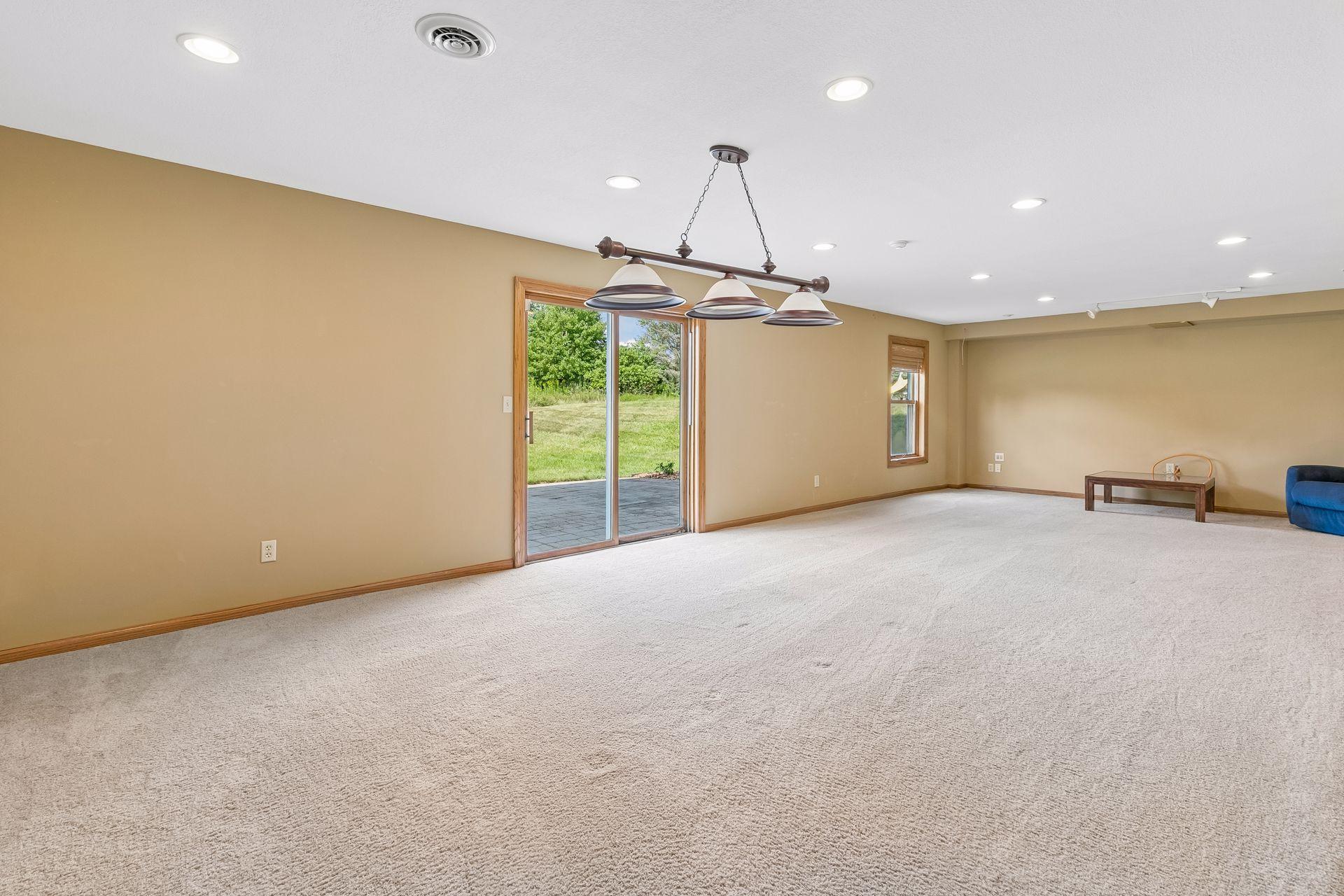 The expansive lower-level recreation and family room offers incredible additional living space plus walkout access to the backyard.