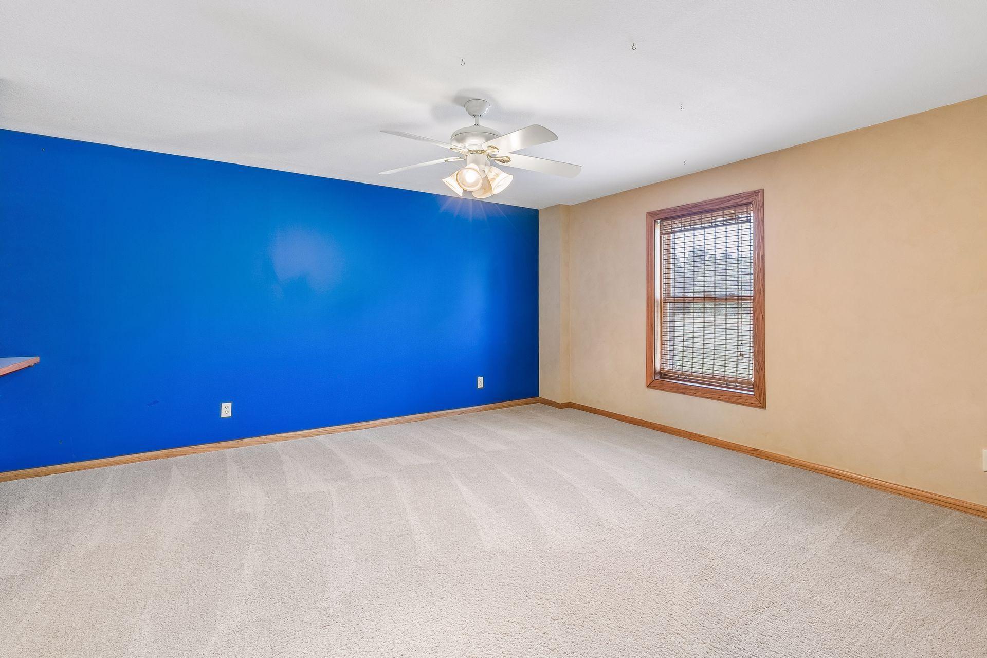 The fifth bedroom is located on the lower level and offers an impressive amount of space for family or overnight guests.