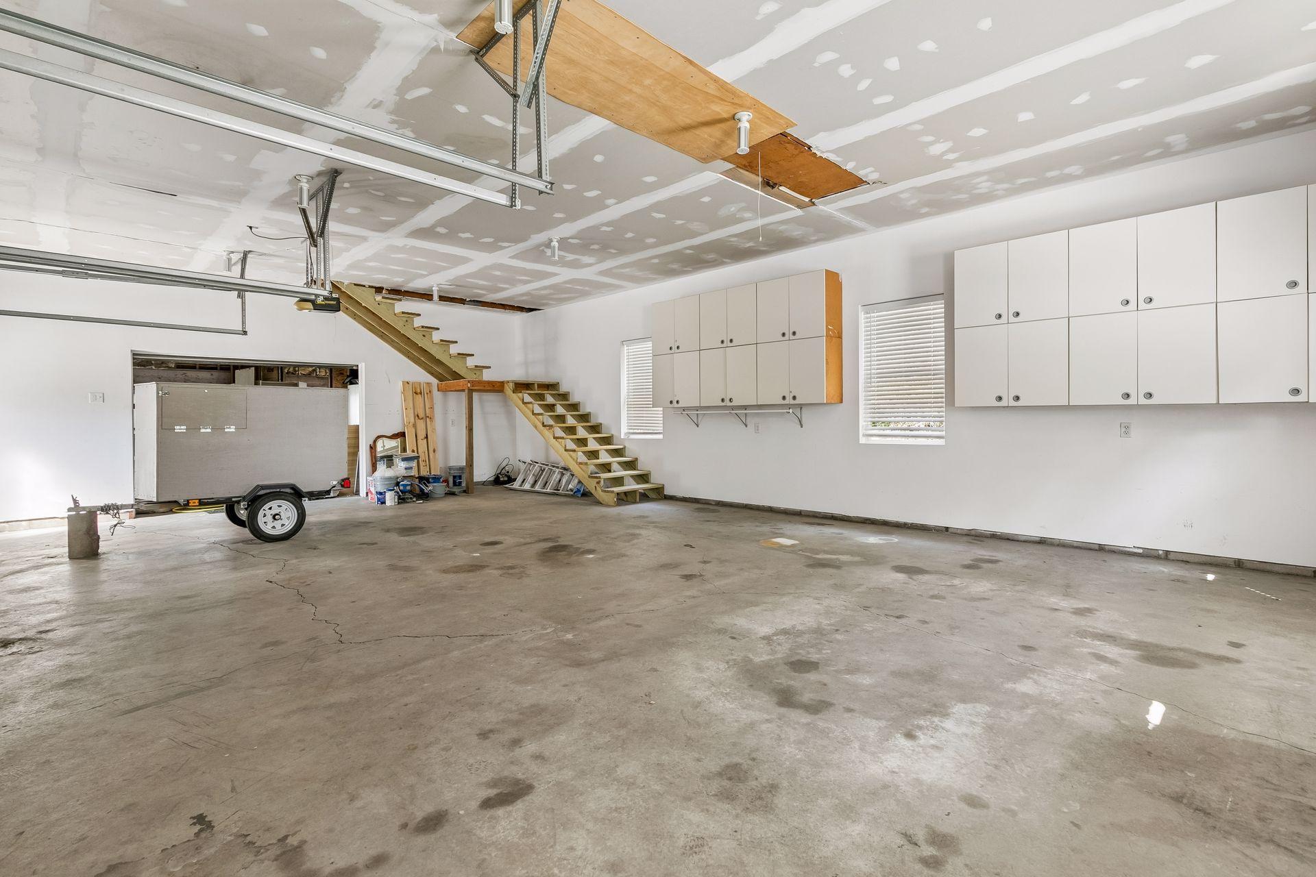 The second 3-car garage offers even more than parking, with stairs leading to an incredible upper-level storage area.