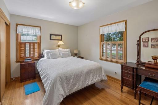 Primary bedroom with original wood floors.